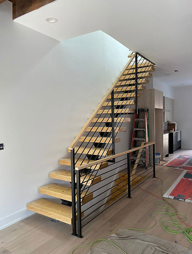 Contemporary staircase with metal railings