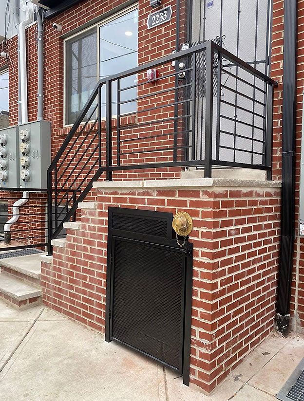 Exterior metal staircase with platform